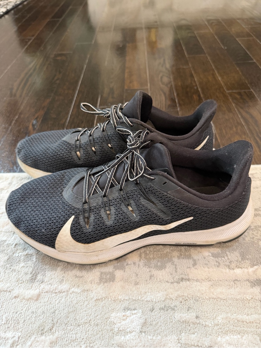 Nike women’s Black Running Shoes with White Swoosh